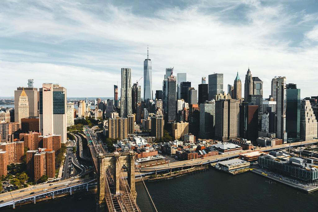 Scenic futuristic cityscape with vibrant skyline at dusk